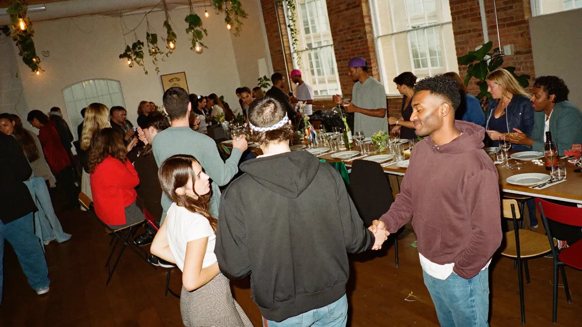 A wide room of founders and talent connecting